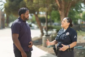 Officer speaking with a man.
