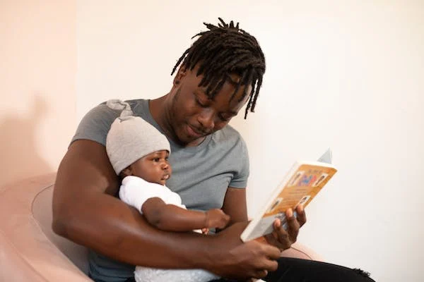 Father with baby reading book