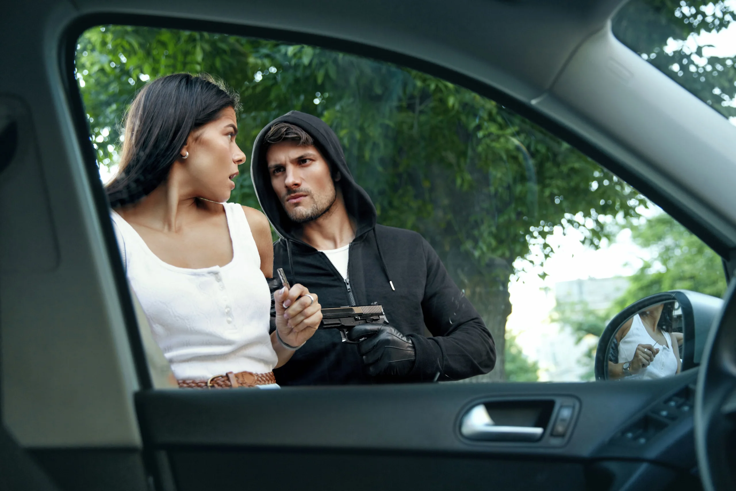 Man holds gun towards woman. Protect your future from serious consequences and call our Texas aggravated assault lawyers today.