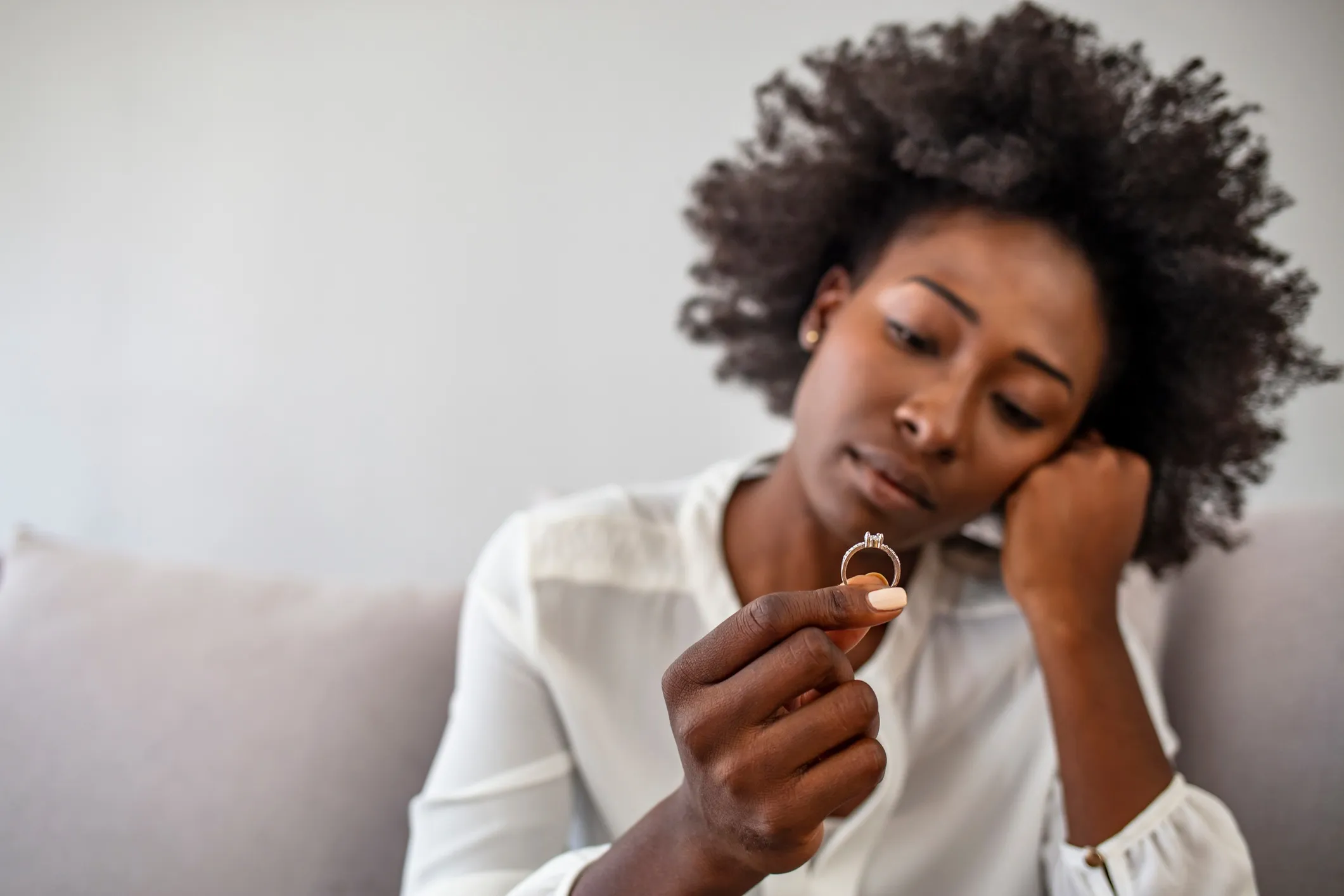 A woman looking at her wedding ring.