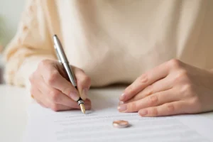 A person signing annulment papers.