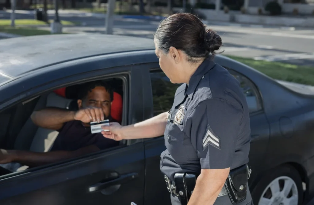 Police officer requesting driver’s license during a DUI stop.